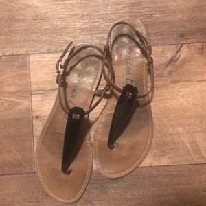 Brown and black sandals